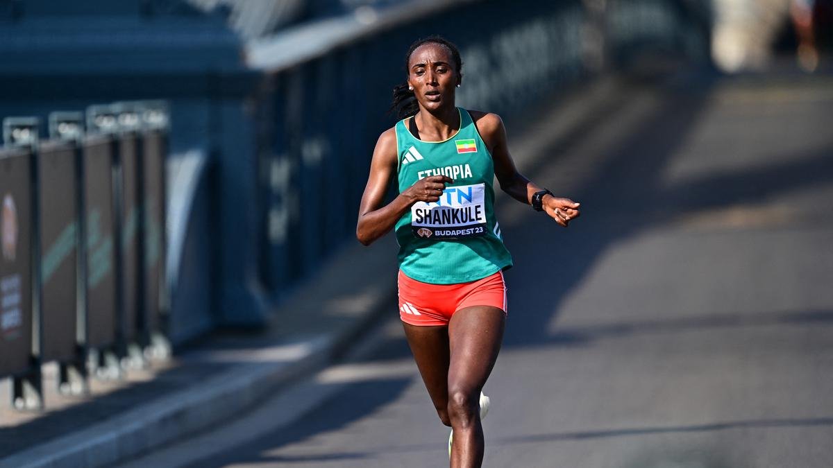Ethiopian athlete Alemu Beriso crossing the marathon finish line at the World Athletics Championships 2023