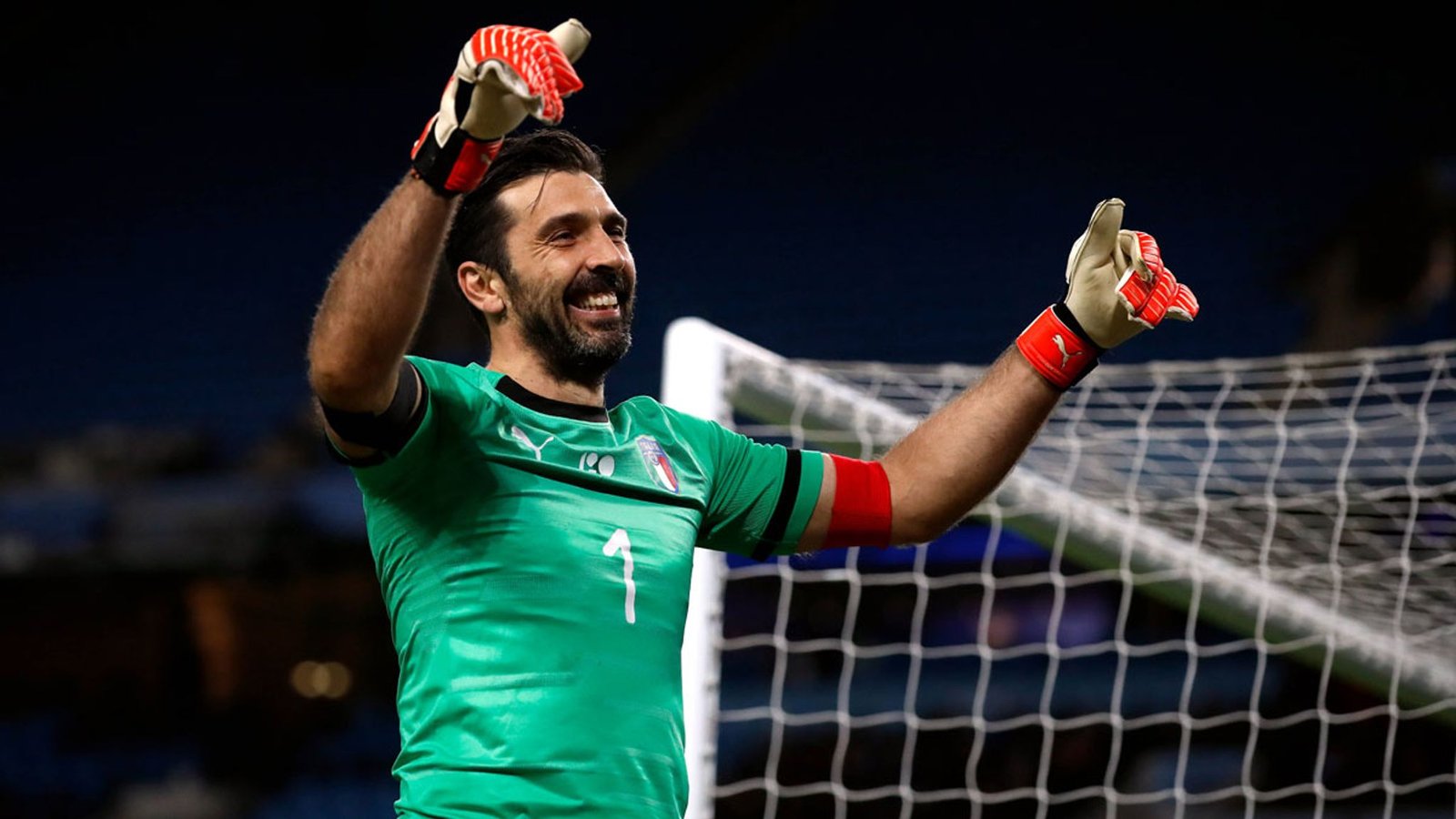 A snapshot of Buffon celebrating a victory with his teammates, highlighting his contributions to the sport.